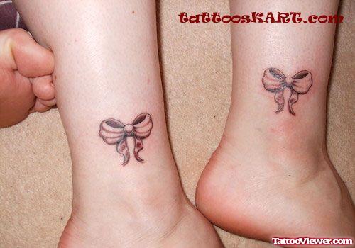 Grey Ink Bow Heel Tattoos