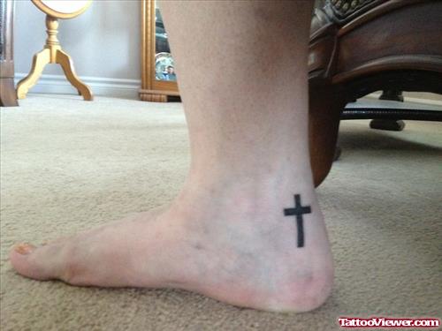 Black Ink Cross Heel Tattoo