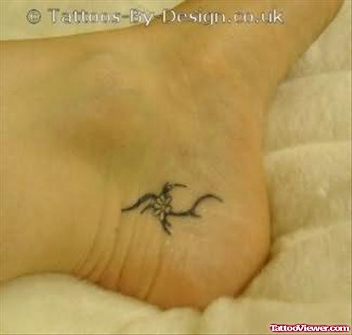 Tribal And Flower Heel Tattoo