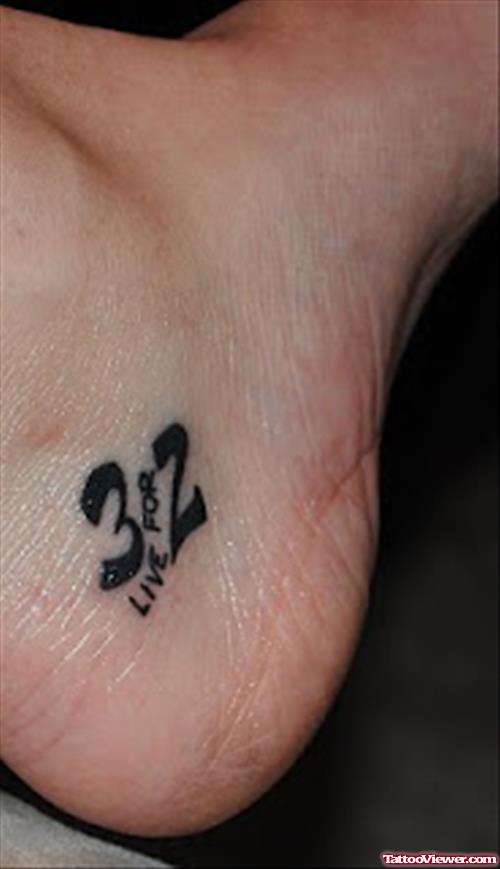 Black Ink Heel Tattoo