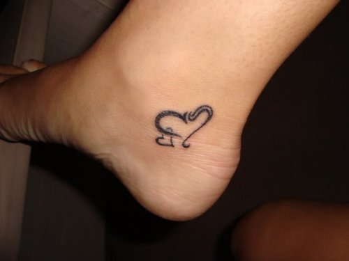 Grey Ink Heart Heel Tattoo