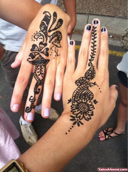 Girls Showing Her Henna Tattoos On Hands