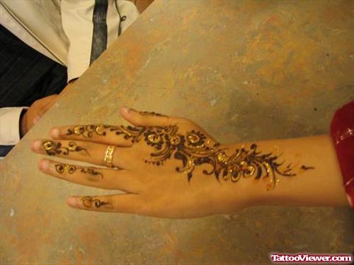 Girl Left Back Hand Henna Tattoo