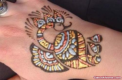 Colored Henna Tattoo On Right Back Hand