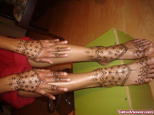 Girl Showing Her Henna Tattoos On Hands and Feet