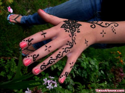 Girl Showing Her Henna Tattoo On Left Hand
