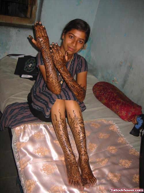 Girl With Henna Tattoos On Hands And Legs