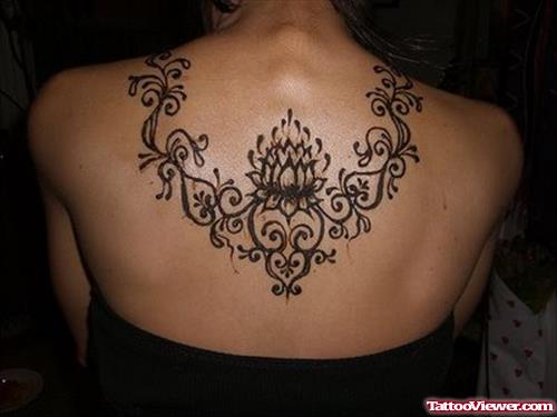 Flowers Henna Tattoo On Girl Upperback