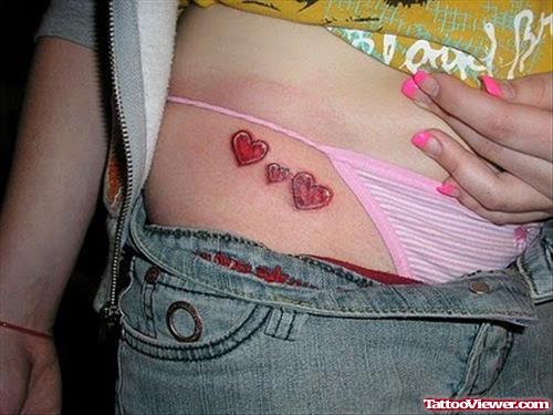 Small Hearts Tattoo On Hip