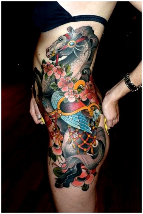 Girl Showing Colored Flowers And Horse Tattoo