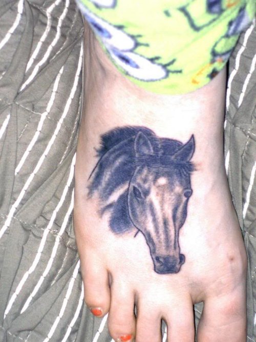 Grey Ink Horse Head Tattoo On foot