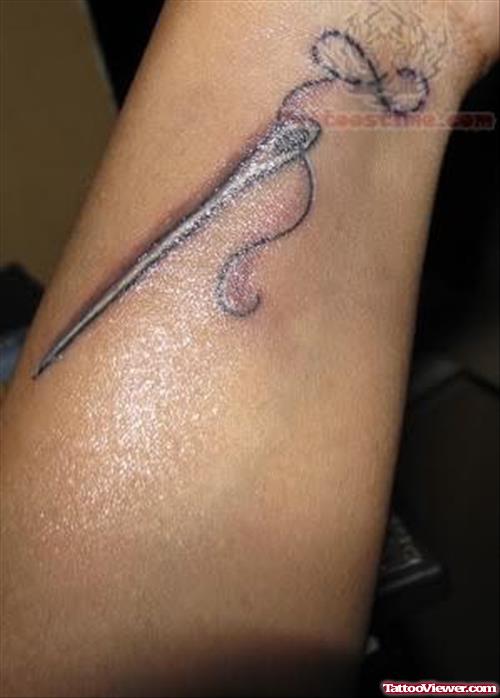 Infinity Symbol And Needle Tattoo