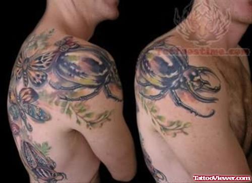Insect Tattoo On Upper Shoulders