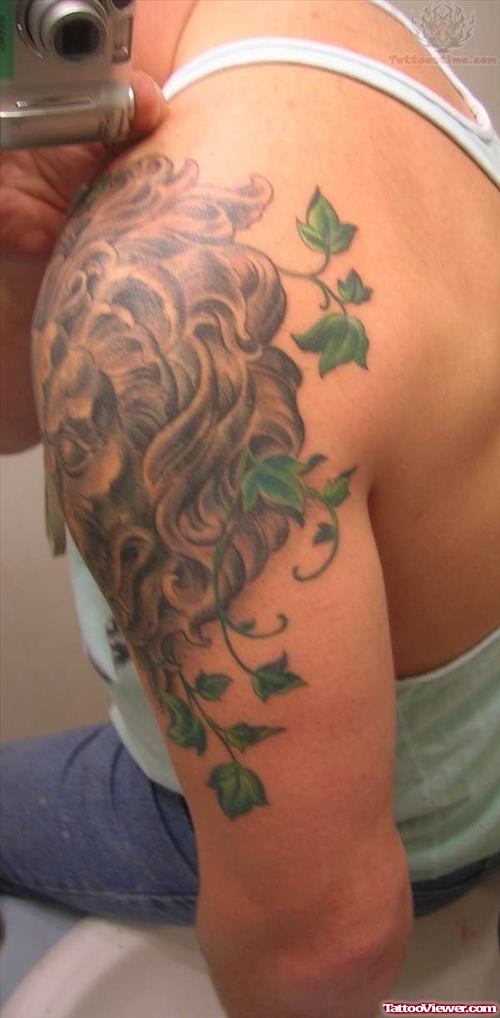Stone Lion And Ivy Rear Tattoo