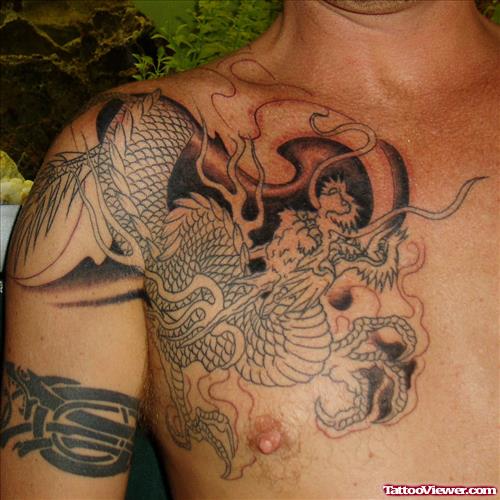 Attractive Grey Ink Japanese Dragon Tattoo On Man Chest