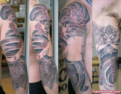 Lotus Flower And Dragon Japanese Tattoo On Sleeve