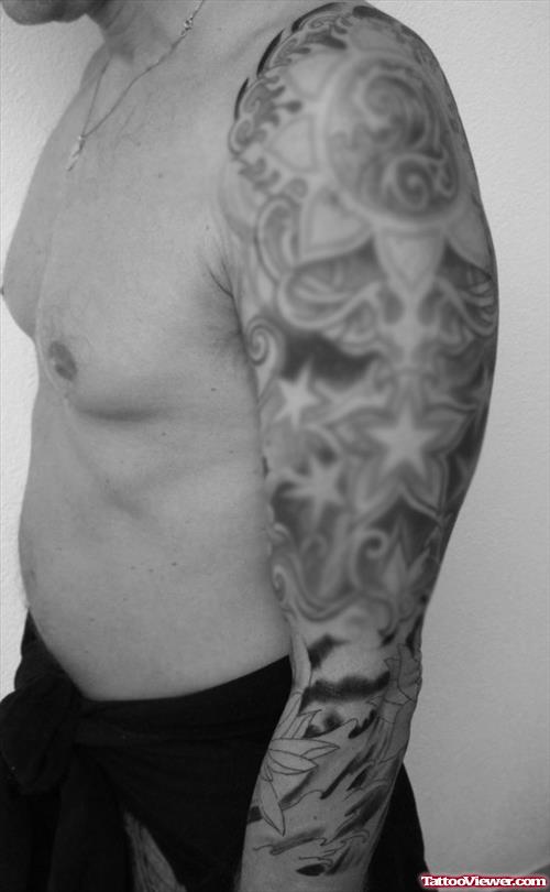 Grey Ink Stars and Waves Japanese Tattoo On Left Sleeve