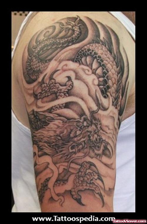 Awesome Grey Ink Japanese Dragon Tattoo On Half Sleeve