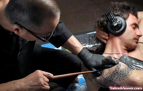 Amazing Grey Ink Japanese Tattoo On Man Chest