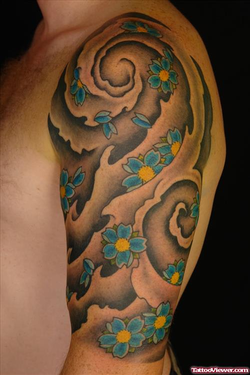 Blue Flowers Japanese Tattoo On Left Half Sleeve