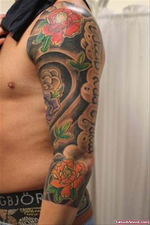 Colored Japanese Tattoo On Man Left Sleeve