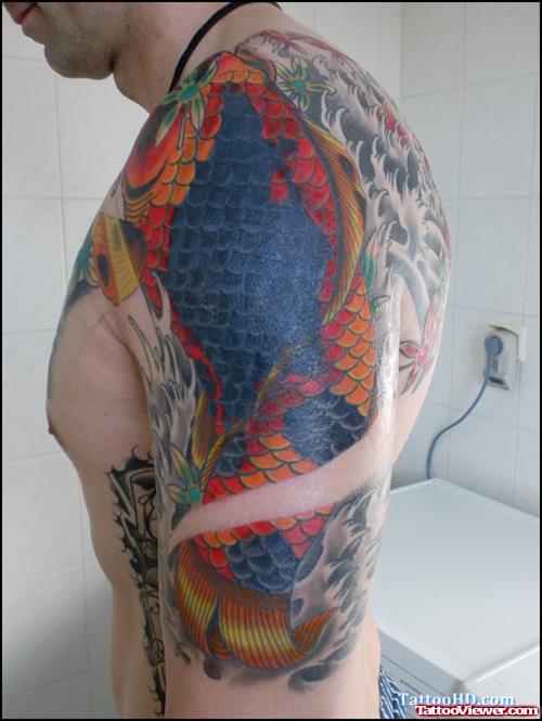 Colored Japanese Tattoo On Man Left Half Sleeve