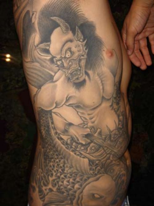 Grey Ink Japanese Tattoo On Man Right Side