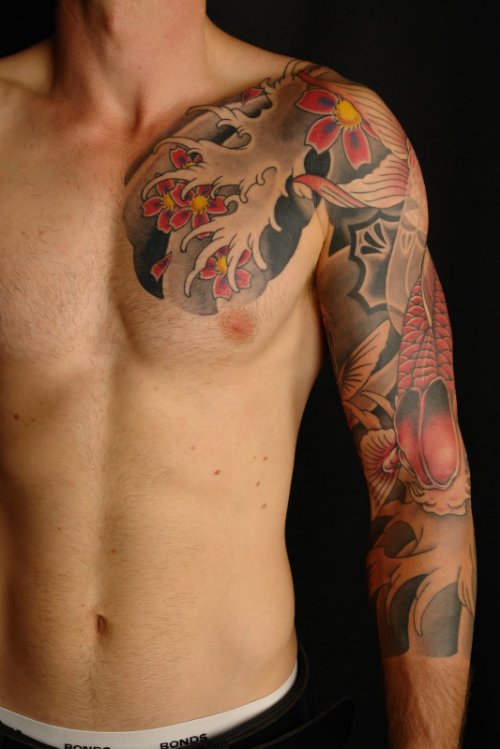 Japanese Tattoo On Man Chest And Left Sleeve