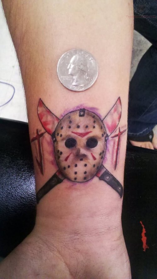 Knifes Cross And Jason Vorhees Tattoo On Wrist