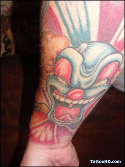 Color Jester Tattoo On Right Forearm