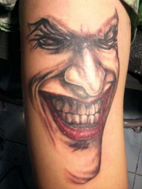 Smiling Jester Tattoo On Half Sleeve