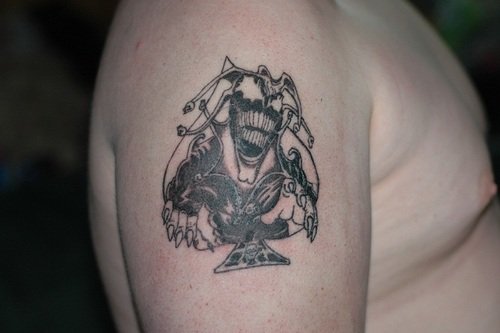 Attractive Grey Ink Jester Tattoo On Man Right Shoulder