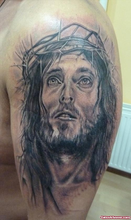 Grey Ink Jesus Head Tattoo On Left Half Sleeve