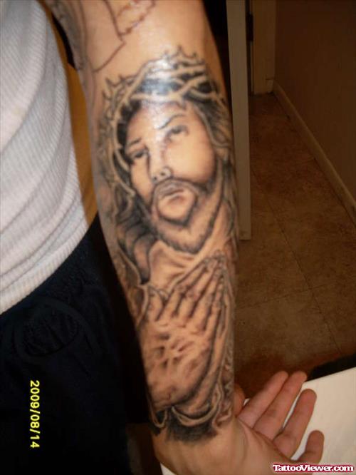 Fuy With Praying Hands And Jesus Tattoo On Arm