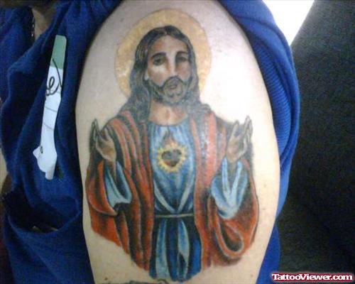 Colored Jesus Tattoo On Man Left Shoulder
