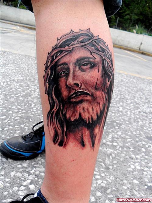 Beautiful Grey Ink Jesus Tattoo On Left Leg