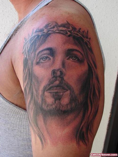 Left Bicep Jesus Head Tattoo