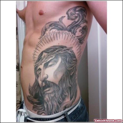 Grey Ink Jesus Head Tattoo On Side Rib