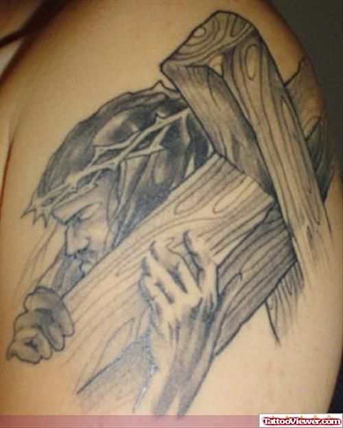 Grey Ink Jesus Christ With Cross Tattoo On Shoulder
