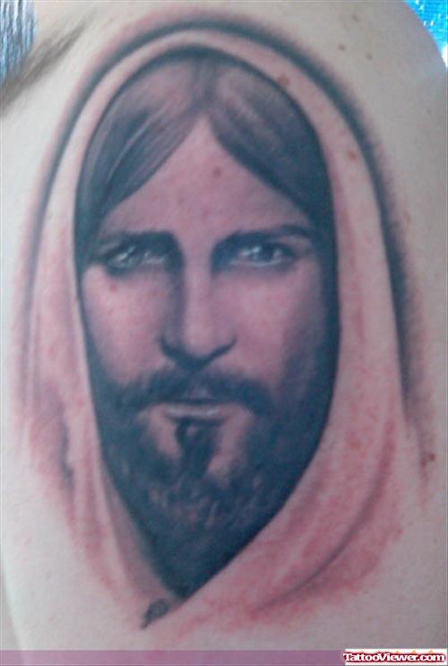 Grey Ink Jesus Head Tattoo On Man Shoulder