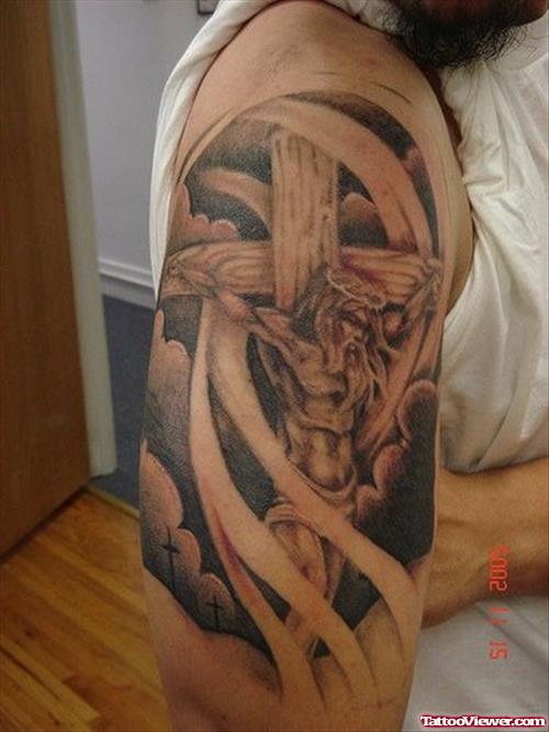 Grey Ink Cross and Jesus Tattoo On Man Right Half Sleeve