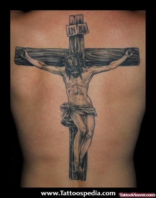 Grey Ink Cross And Jesus Tattoo On Back Body