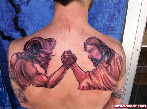 Devil Vs Jesus Tattoo On Man Back