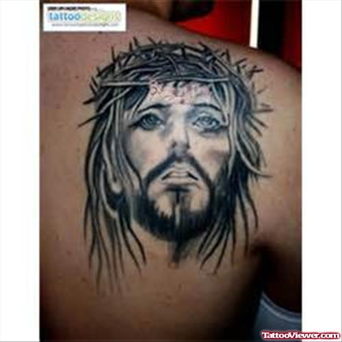 Grey Ink Jesus Head Tattoo On Right Back Shoulder