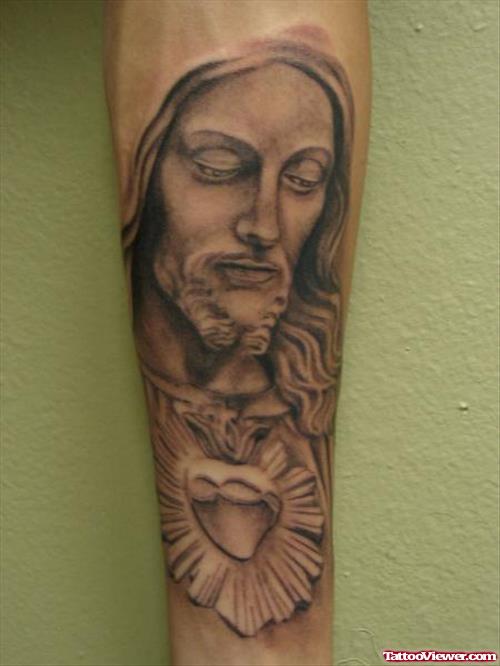 Grey Ink Sacred Heart And Jesus Head Tattoo On Sleeve