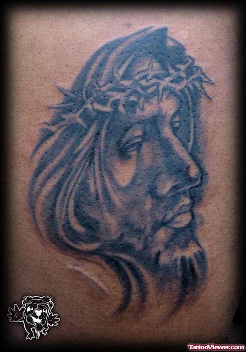 Grey Ink Jesus Face Tattoo