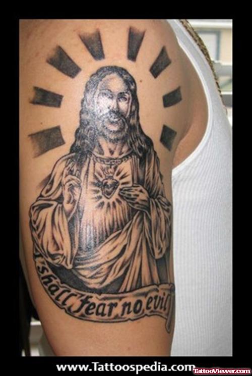 Grey Ink Jesus Tattoo On Man Right Half Sleeve