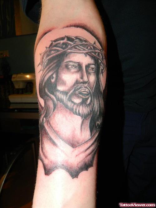 Grey Ink Jesus Face Tattoo On Right Forearm