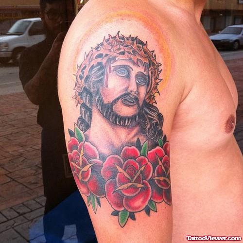 Red Flowers And Jesus Head Tattoo On Right Shoulder