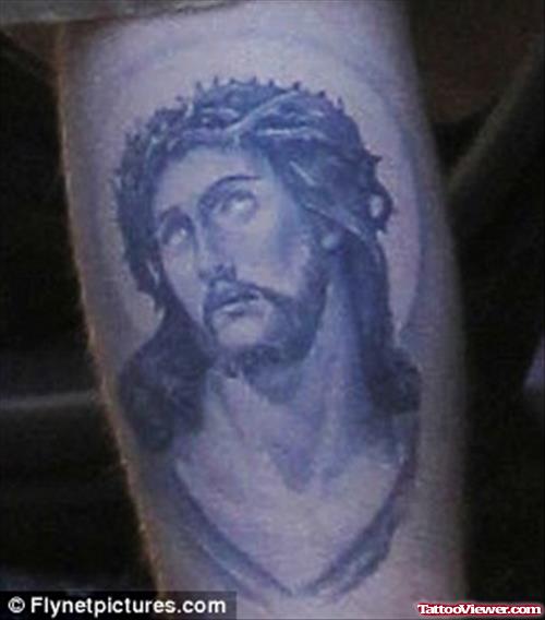 Grey Ink Jesus Head Tattoo On Bicep